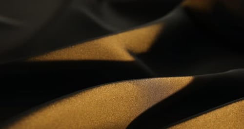 Golden Light on Woven Fabric Texture Background