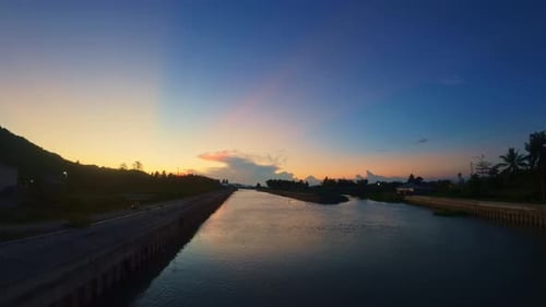 Scenic Sunset Over Calm River Landscape