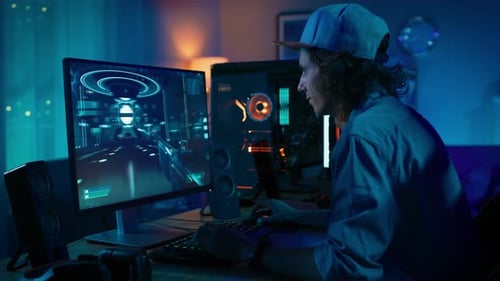Young Man Playing Video Games at Home at Night