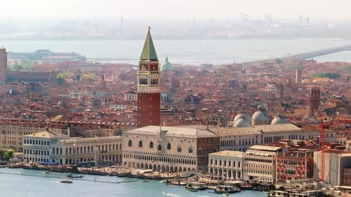 Aerial drone view of St. Mark's Square in Venice Italy, with the city on the background