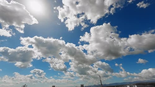 Time-Lapse of Clouds Drifting Across Blue Sky