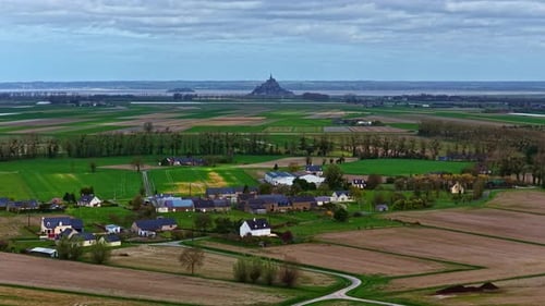 Aerial views of Mont Saint Michel and rural village in Normandy France