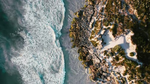 Mighty ocean waves crashing along a breathtaking coastline.