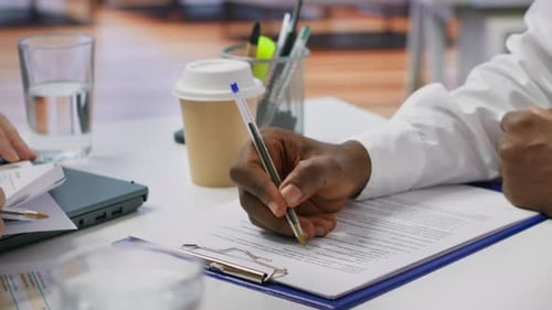 Signing Documents in Bright Office Setting