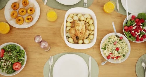 Festive Table Set with Chicken Dinner and Salads