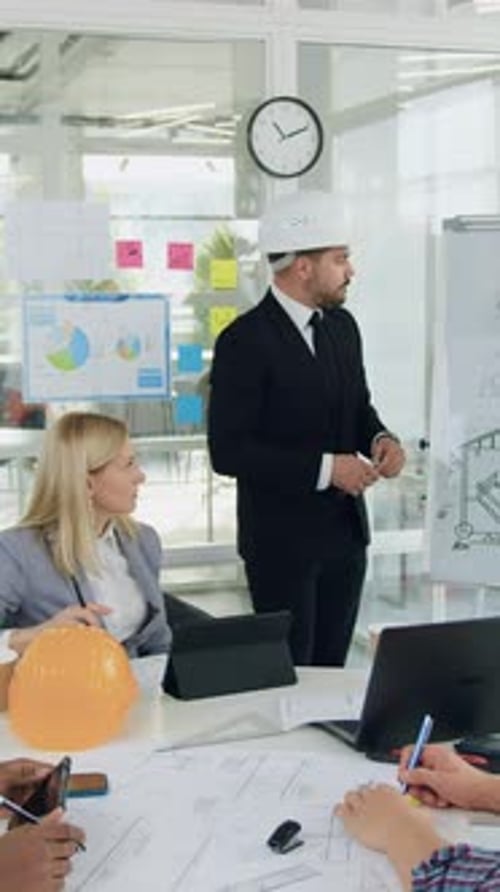 Portrait of Attractive Confident Highskilled Multiethnic Specialists of Building Company Which