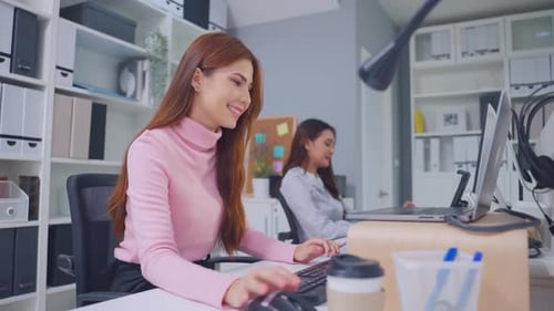 Asian beautiful businesswoman using laptop computer working in office.