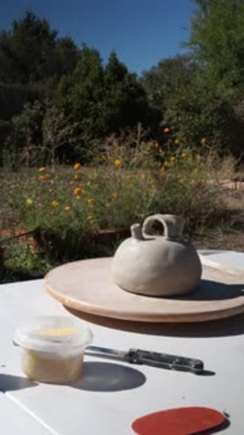 Clay Pottery Under Construction Outdoors on Sunny Day