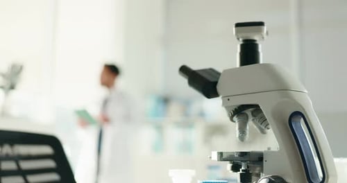 Microscope, science and person with technology for forensic research or medical discovery at lab