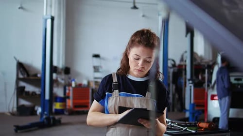 Smiling Engineer Checks Car Performance