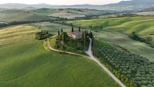 Aerial video on the hills of Tuscany in San Quirico, Belvedere view at sunrise - Tuscany