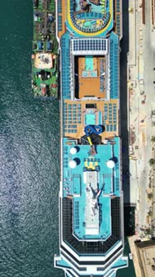 Aerial drone view of a cruise ship on the Mediterranean sea, near the walled city of Valletta, Malta