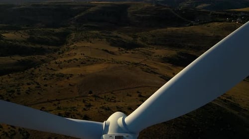 Wind Turbine Rotating in Vast Rural Landscape