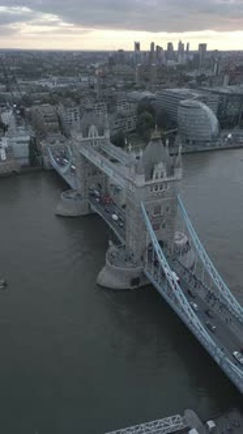 Aerial video of the city of London and the lighthouse bridge in London at night