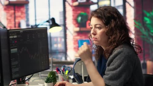 Financial Investor Works on PC Analyzing Stock Market Trends