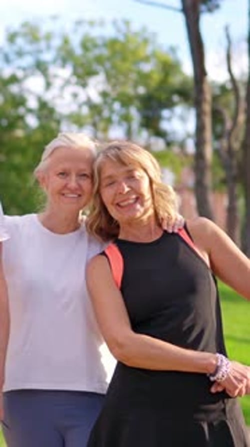 Two Senior Women Friends Smiling at a Park