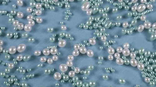 Pearls on Blue Fabric