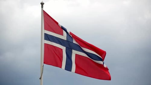 Flag Waving Against Cloudy Sky