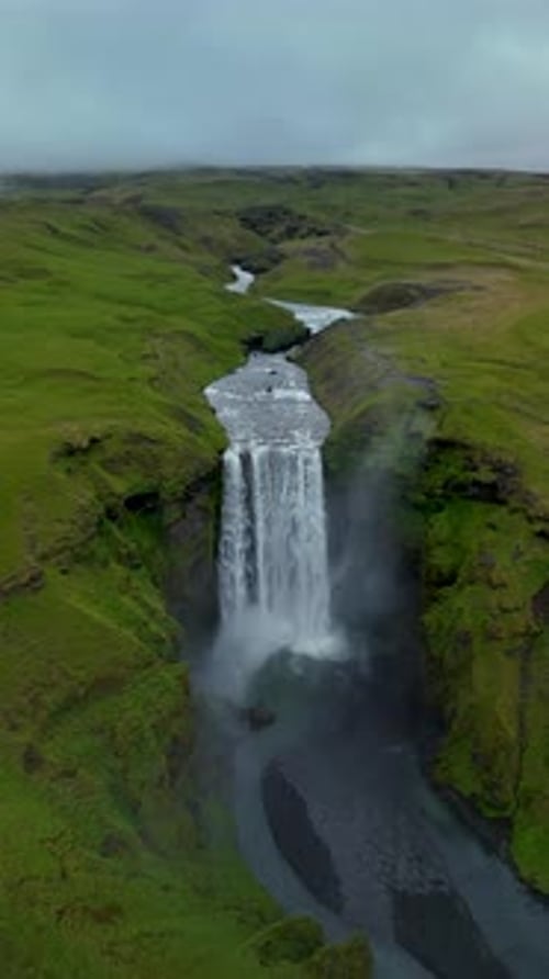 Dramatic Landscape of Skogafoss Waterfall Flowing From Volcanic Mountain in South of Iceland