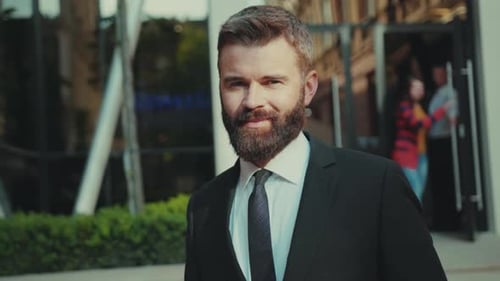 Portrait Smiling Attractive Businessman with Beard Standing Look at Camera Close Up Outdoors Sunset