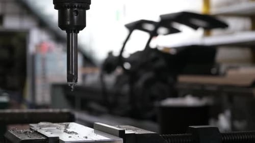 Drill Press Machining Metal in a Workshop