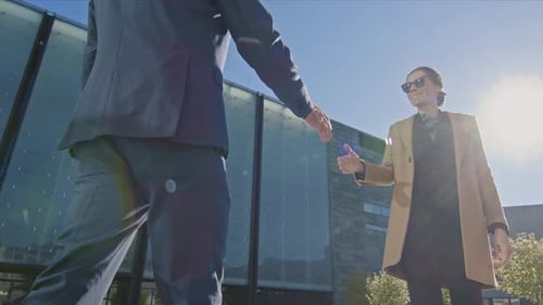 Business People Meeting and Shaking Hands Outdoors