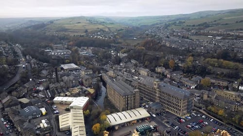 Industrial town, village in the heart of the bleak West Yorkshire Pennies Hills. Aerial view of the