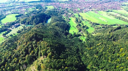 aerial flight over green valley and small villages, 4k