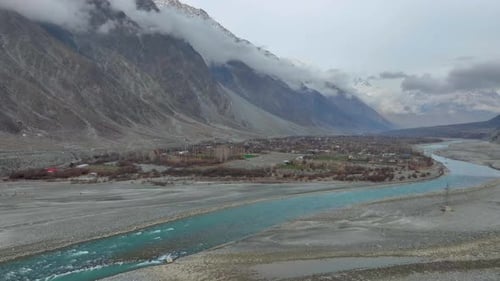 Turquoise River Flows Through Mountain Valley