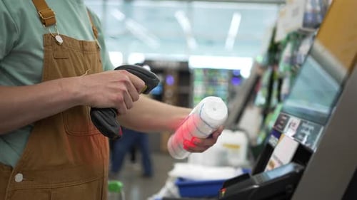 Construction Worker Scanning Hardware Items at Selfcheckout Using Handheld Barcode Scanner for