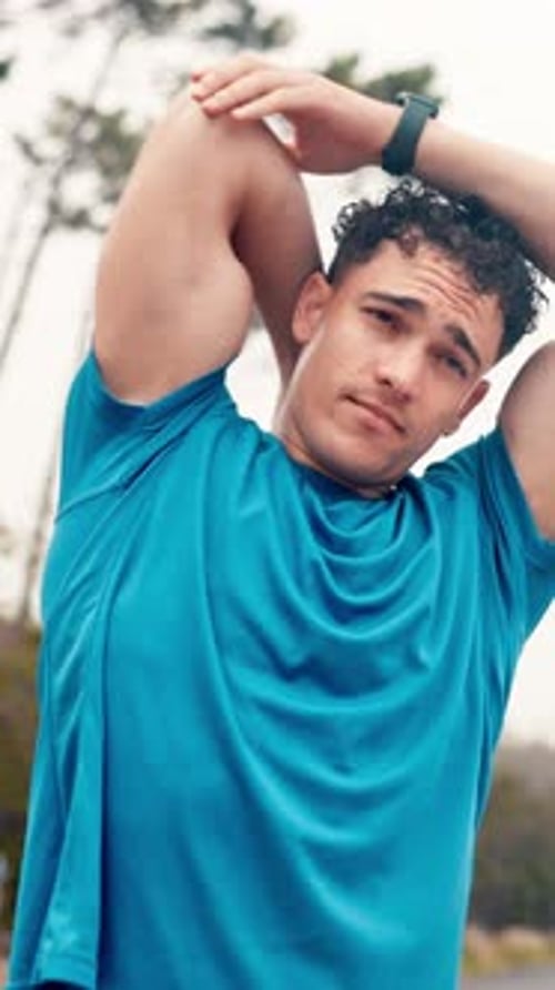 Athletic Man Stretching Arms Outdoors in Nature