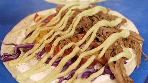 Close Up Food Prep of a Colorful Taco
