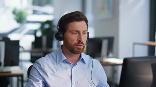 Online Manager Talking Headphones Providing Customer Support in Office Closeup