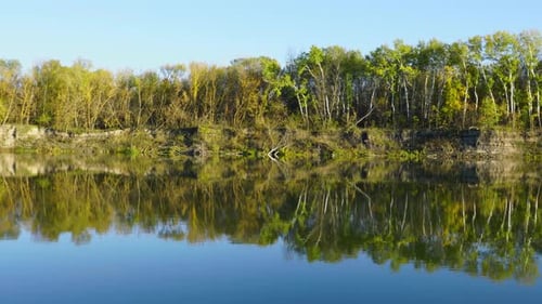 Reflection of Autumn Trees in the Water