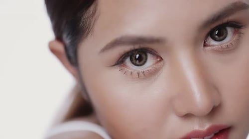 Close up beauty young Asian woman face looking at camera, isolated on white background.