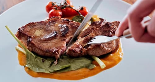 Person, restaurant and hands for cutting meat or poultry food for eating