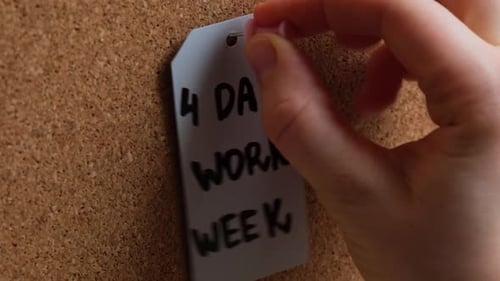 Hand Pin Note 4 Day Work Week Text on Paper Note Pinned to Desk Four Day Working Week Concept Modern