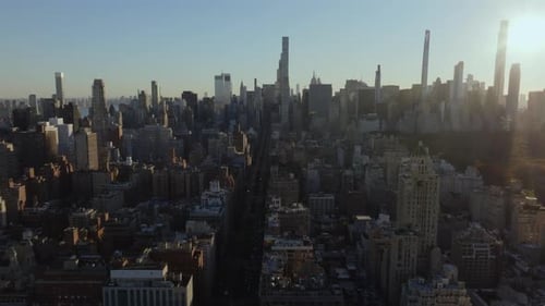 Aerial Views Showcase Sun Casting a Warm Glow on Midtown Manhattan's Modern and Classic Skyscrapers