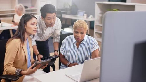 Discussing work, diverse team collaborating on project using laptop and tablet in office