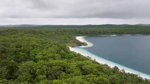 Aerial view of serene lake and beach, Australia.