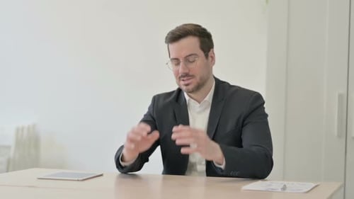 Businessman Discussing Strategy in an Office Setting