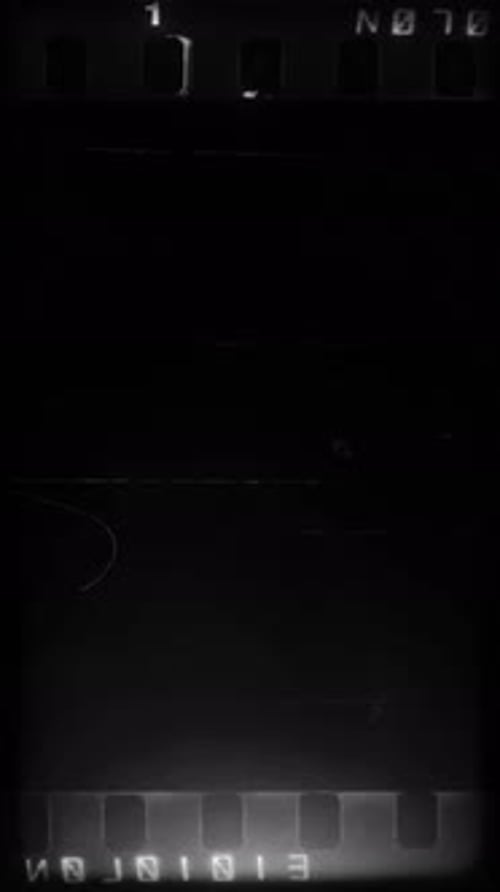 Vertical Film Burn Overlay with Light Leaks and Grunge Texture