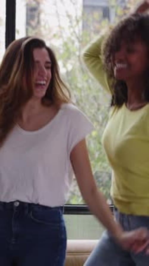 Three Multiracial Young Women Friends Having Party at Home
