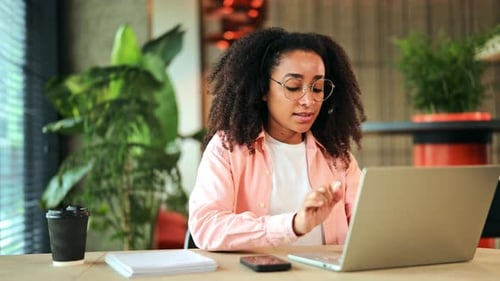 Woman Working At Computer In A Modern Office