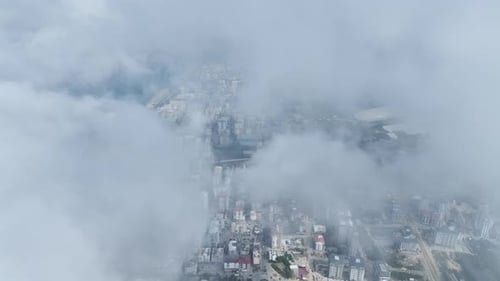 Aerial View Majestic Clouds and Cityscape As Seen From Above
