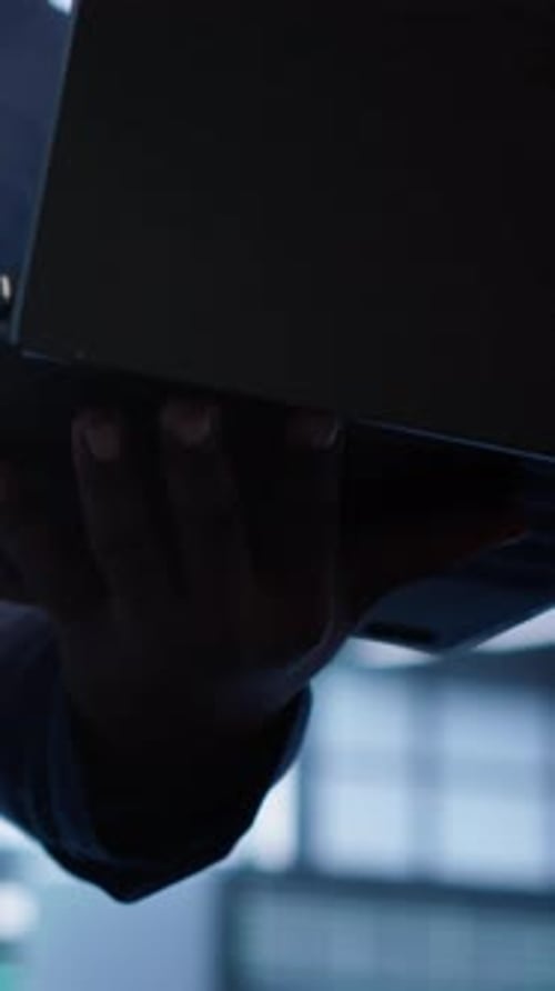 Vertical Video Close Up Shot of Worker Looking for Data Center Network Issues Using Laptop