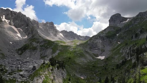Beautiful epic rocks with scatterings of stones and coniferous trees. Mountains Komovi. Montenegro.