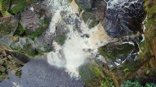 Aerial drone footage of a tall rocky waterfall in the Yorkshire Dales, Pennies. Moorland scene of a