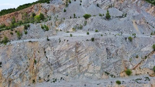 Natural Quarry is Located Near Road Against Backdrop of Rhodope Mountains and Hills with Forests and