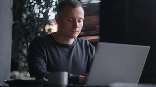 Attractive Confident Man With Laptop In Cafe Portrait Shot Male Freelancer Working Online